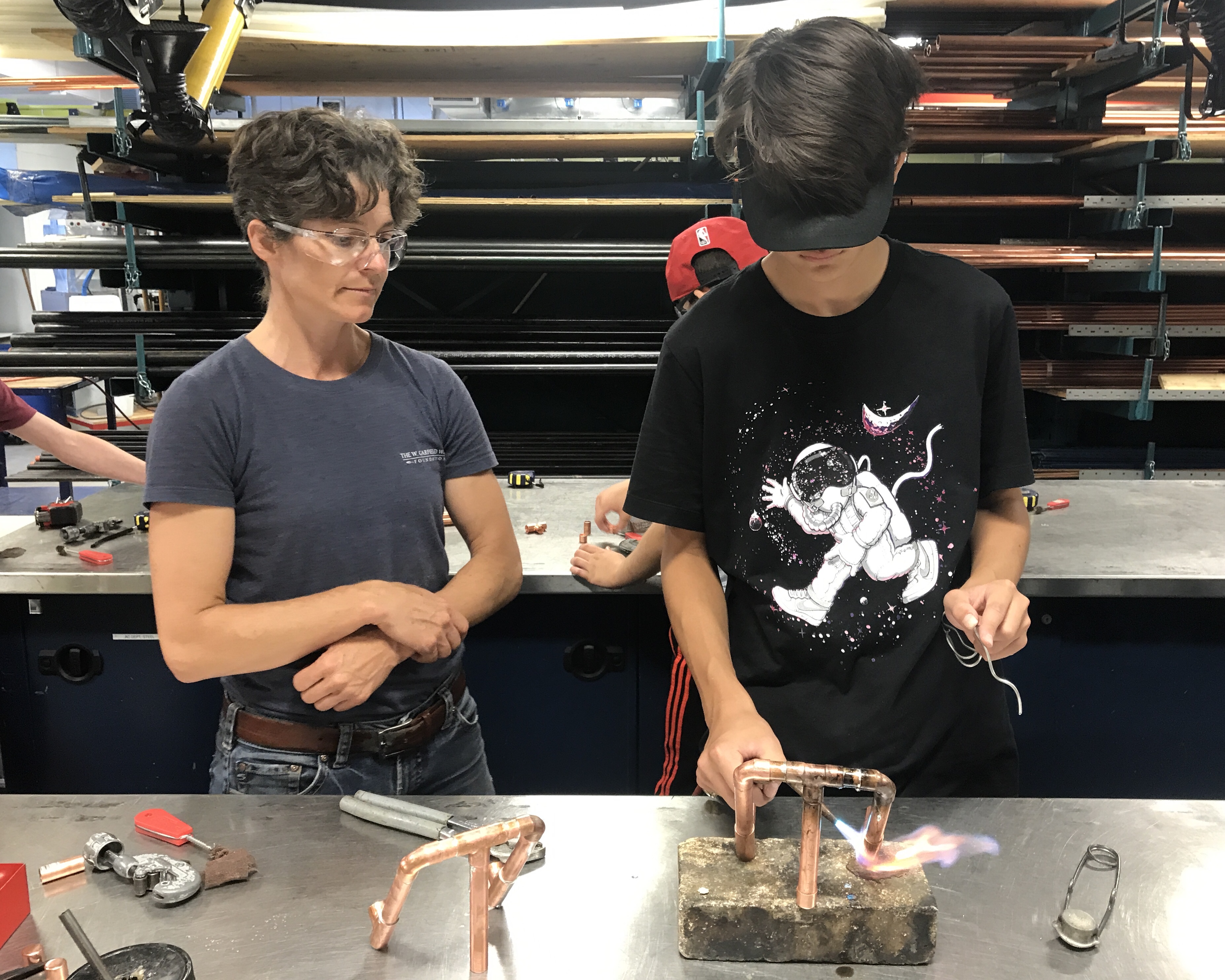 Camper using a blowtorch during a Skills Ontario Regional Summer Camp.