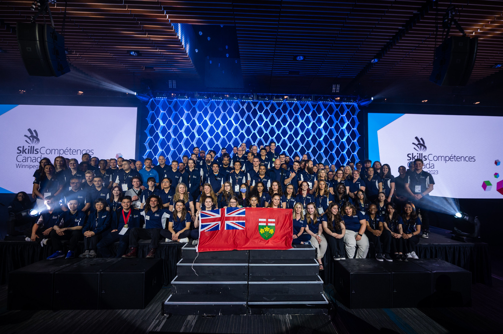 Competitors part of 2023 Team Ontario pose on stage for a group photo during the Closing Ceremony.